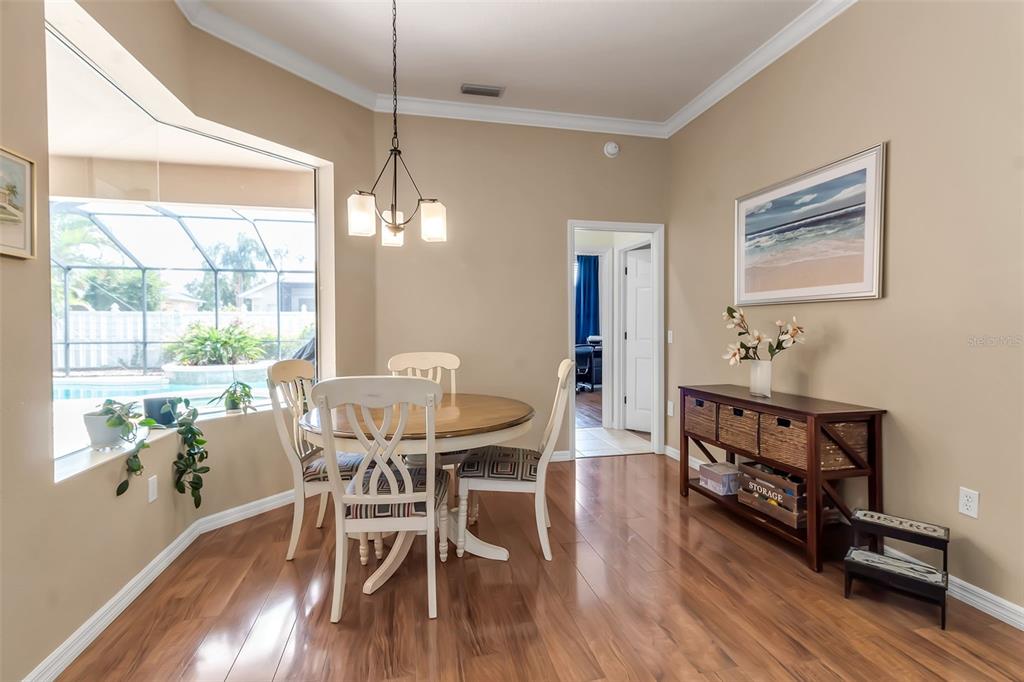 730 Old Quarry Road Bradenton, FL 34212 - Photo 31 of 65 a view of a dining room with furniture window and wooden floor