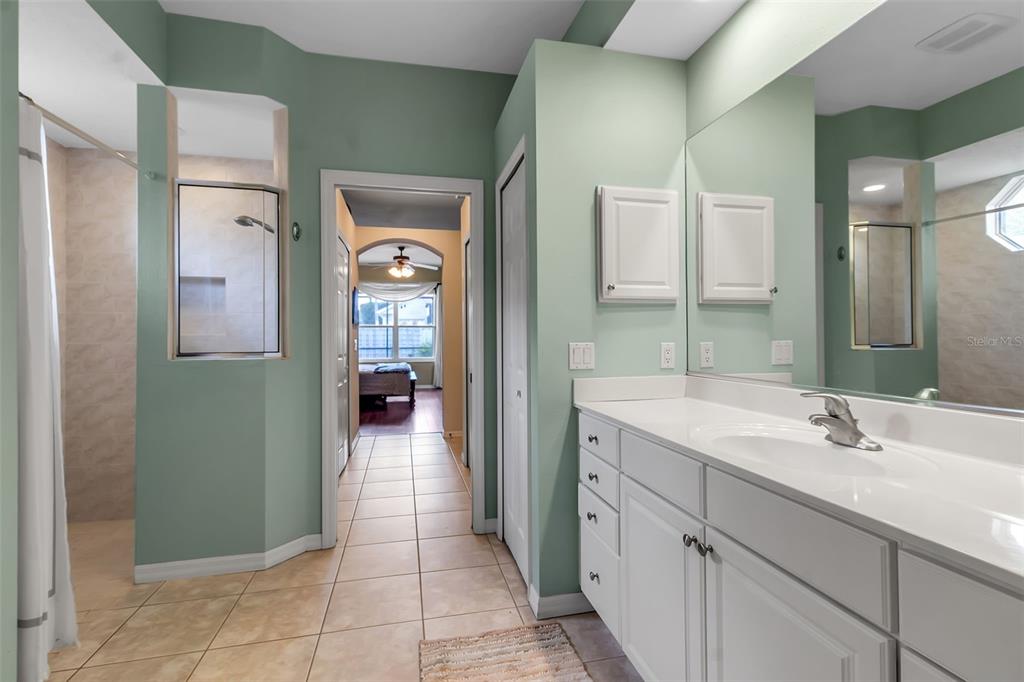 730 Old Quarry Road Bradenton, FL 34212 - Photo 36 of 65 a en suite bathroom with a sink mirror and toilet