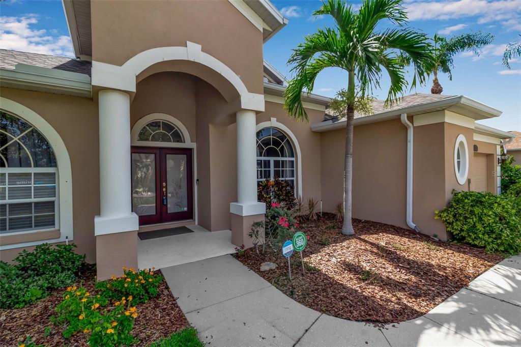 730 Old Quarry Road Bradenton, FL 34212 - Photo 5 of 65 a front view of a house with garden