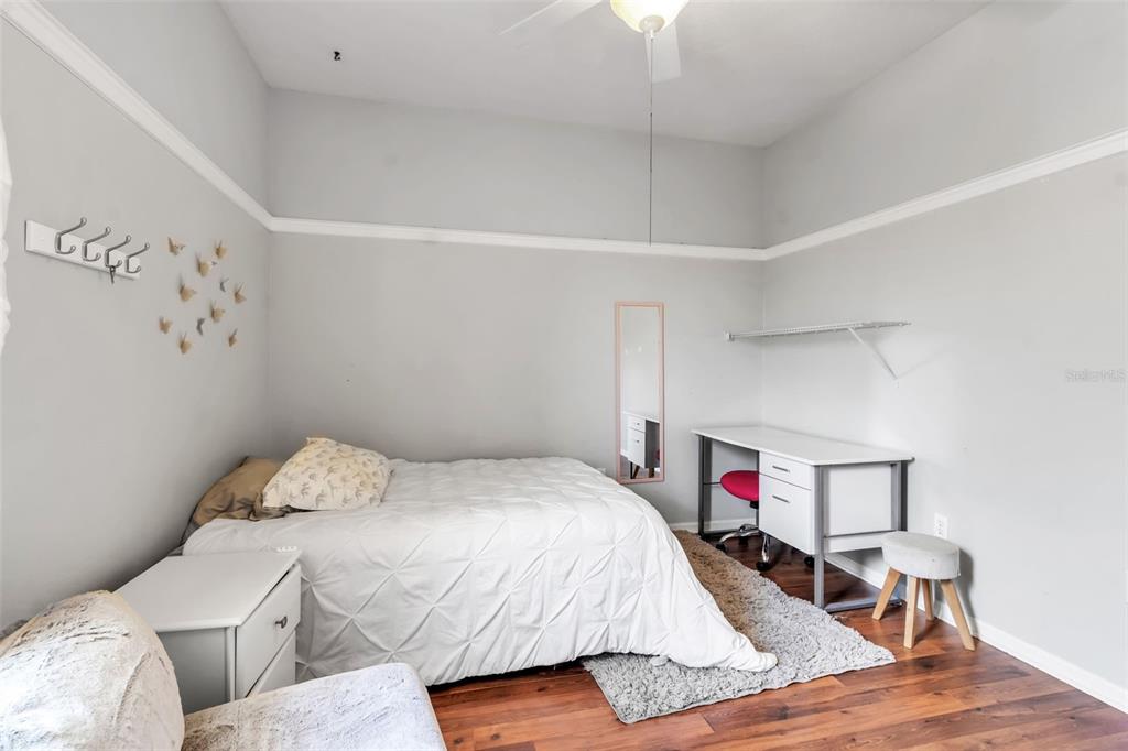 730 Old Quarry Road Bradenton, FL 34212 - Photo 51 of 65 a bedroom with a bed and a wooden floor