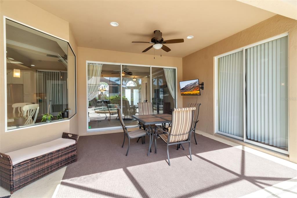 730 Old Quarry Road Bradenton, FL 34212 - Photo 54 of 65 a dining room with wooden floor and glass door
