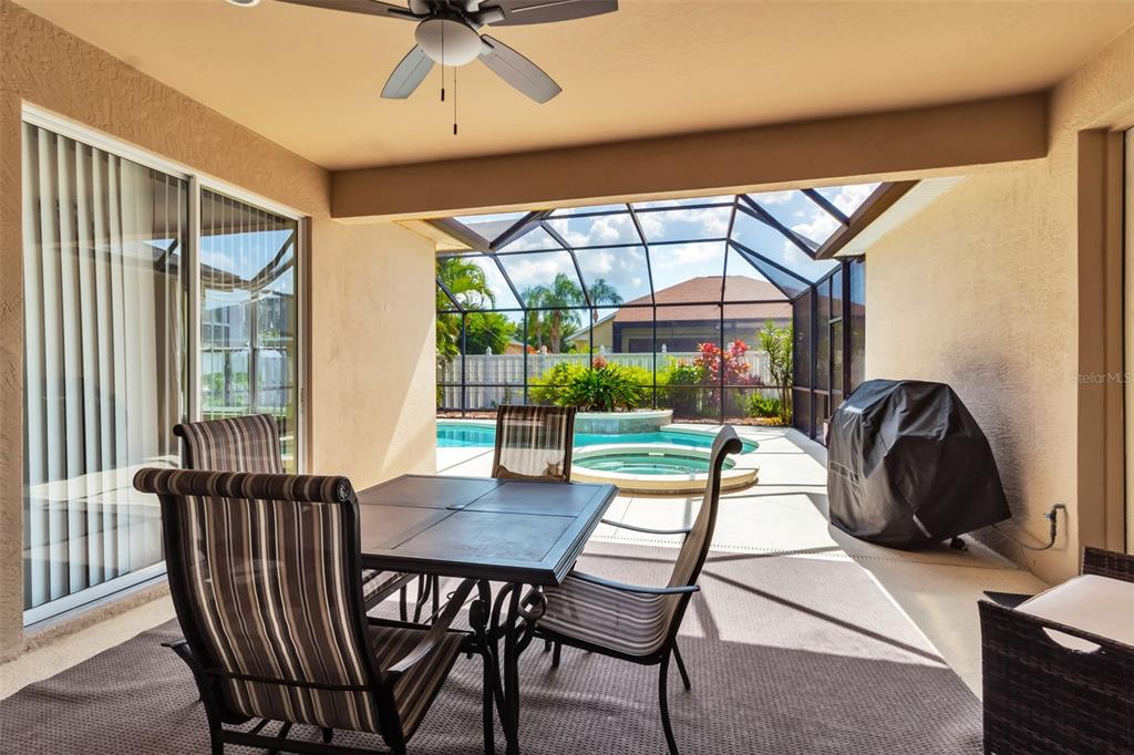 730 Old Quarry Road Bradenton, FL 34212 - Photo 57 of 65 a dining room with furniture a chandelier and a rug