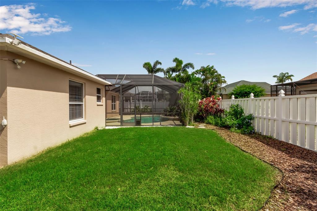 730 Old Quarry Road Bradenton, FL 34212 - Photo 63 of 65 a front view of a house with a garden