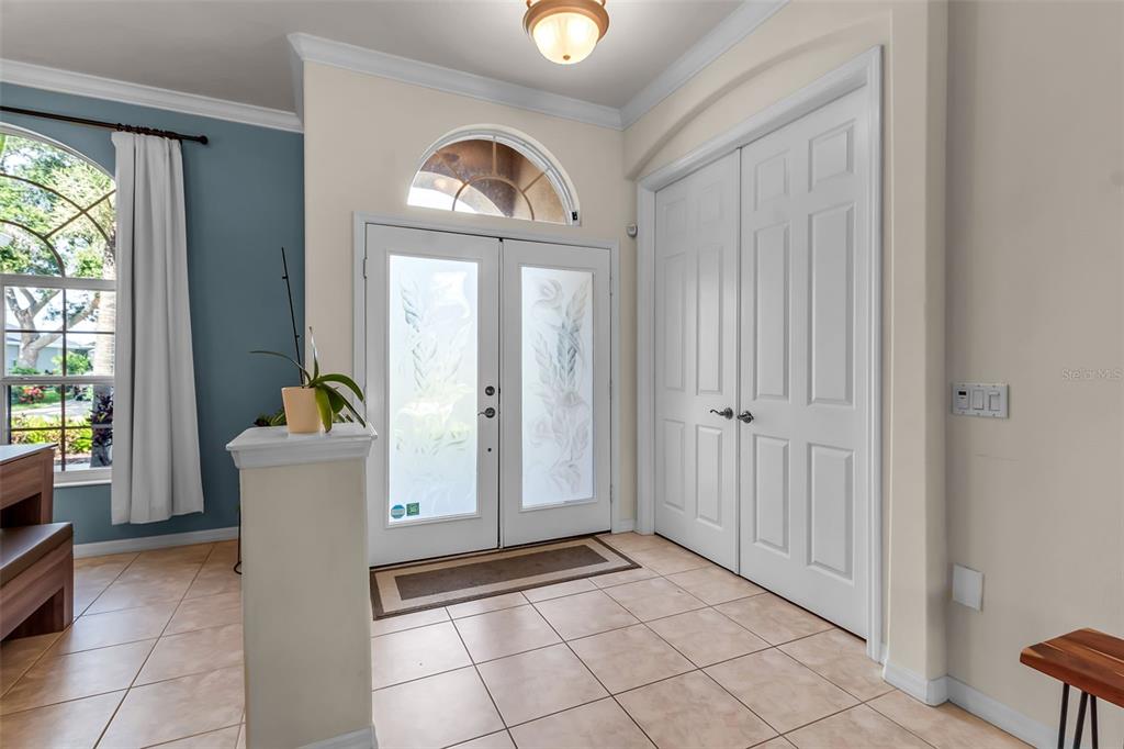 730 Old Quarry Road Bradenton, FL 34212 - Photo 7 of 65 a view of a hallway with entryway and dining room view