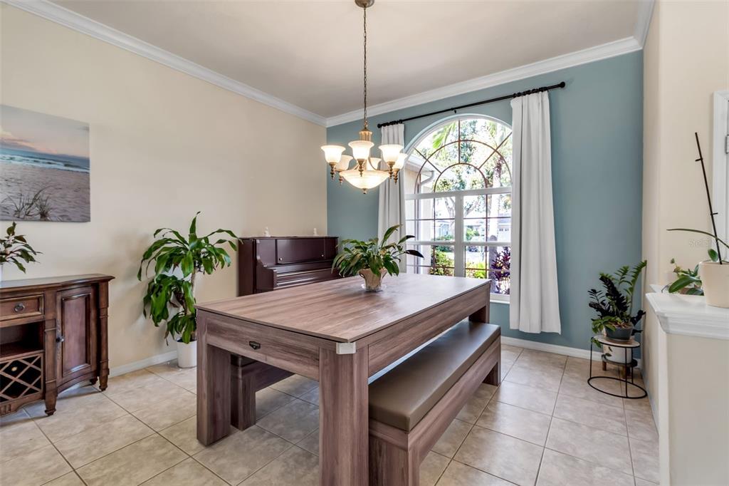 730 Old Quarry Road Bradenton, FL 34212 - Photo 9 of 65 a room with furniture and a chandelier