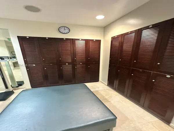 a room with gym equipment and a large window