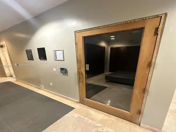 a room with lots of chairs and mirrors