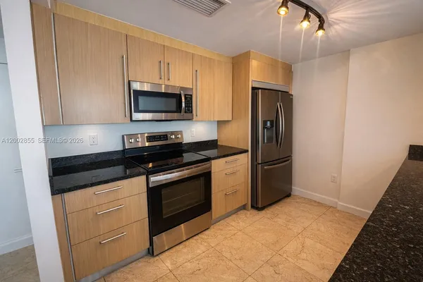 a kitchen with a sink and a window