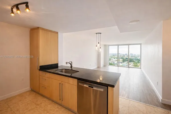 a view of kitchen with wooden floor