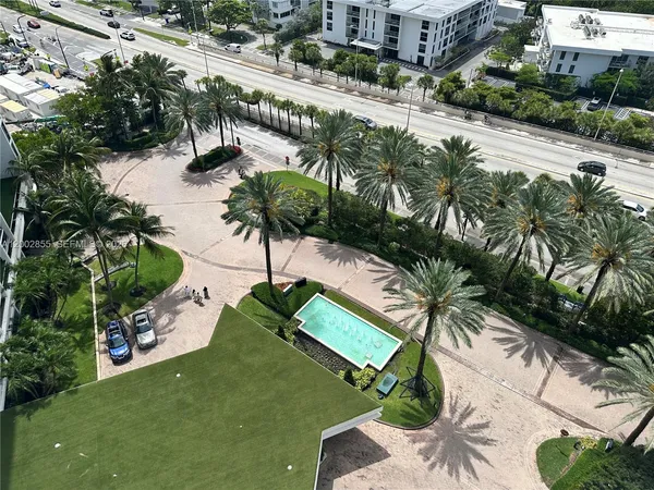 a view of a swimming pool and lounge chair