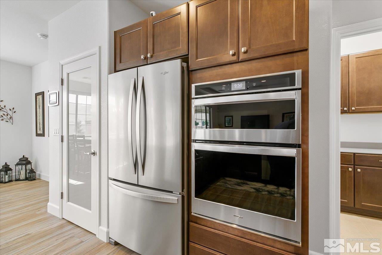 9934 Autumn Sage Drive Reno, NV 89521 - Photo 15 of 39 a kitchen with cabinets and stainless steel appliances