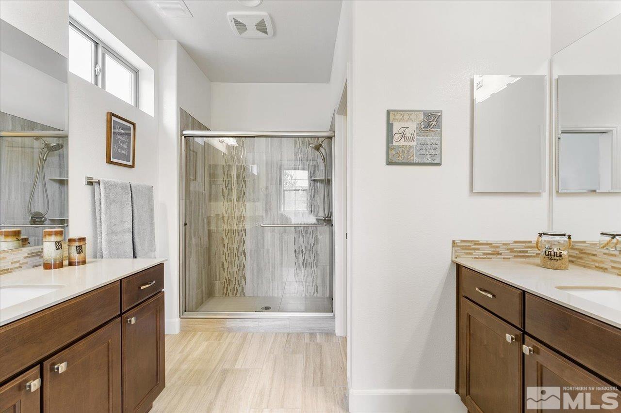 9934 Autumn Sage Drive Reno, NV 89521 - Photo 20 of 39 a bathroom with a sink a shower and a mirror