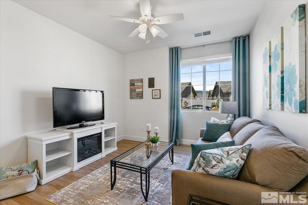 9934 Autumn Sage Drive Reno, NV 89521 - Photo 25 of 39 a living room with furniture and a flat screen tv