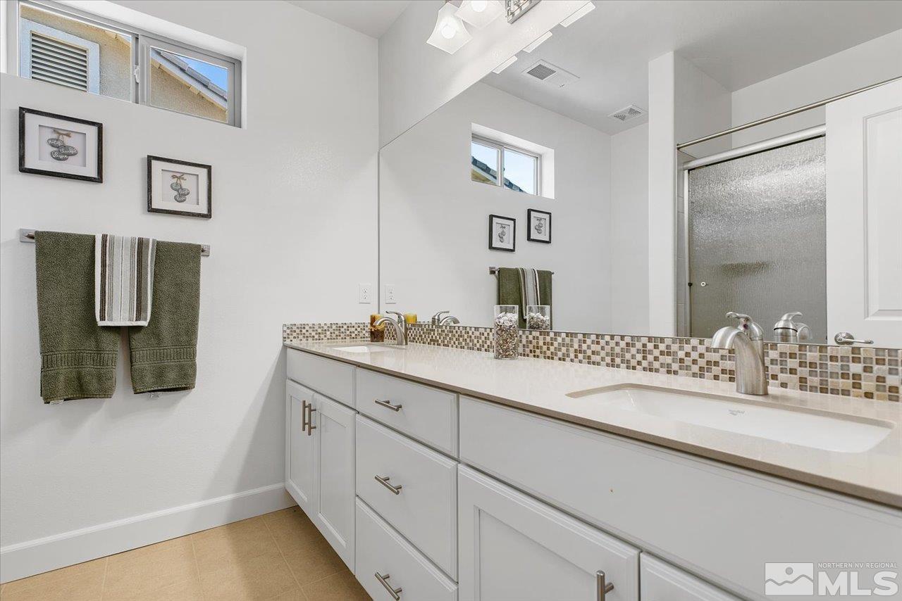 9934 Autumn Sage Drive Reno, NV 89521 - Photo 32 of 39 a bathroom with a sink and mirror