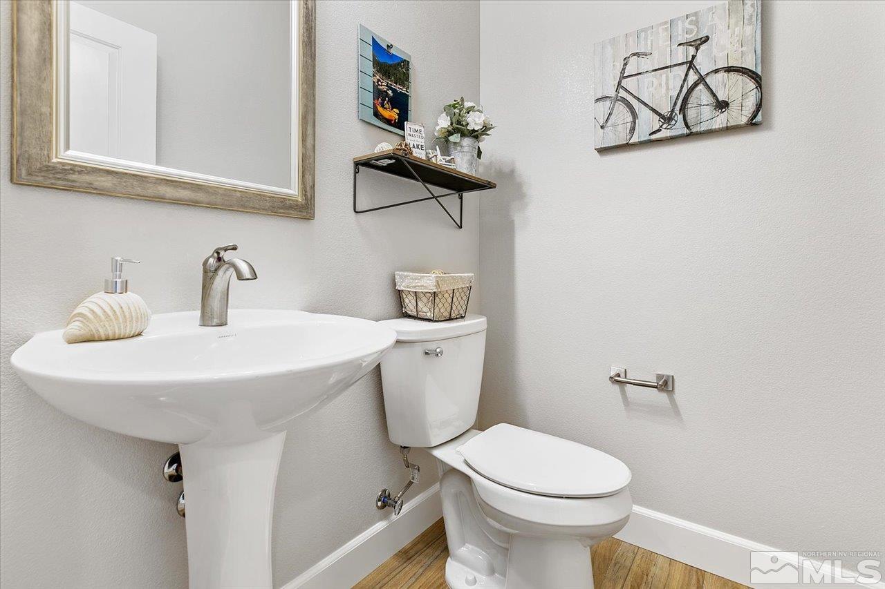 9934 Autumn Sage Drive Reno, NV 89521 - Photo 33 of 39 a bathroom with a sink mirror and toilet