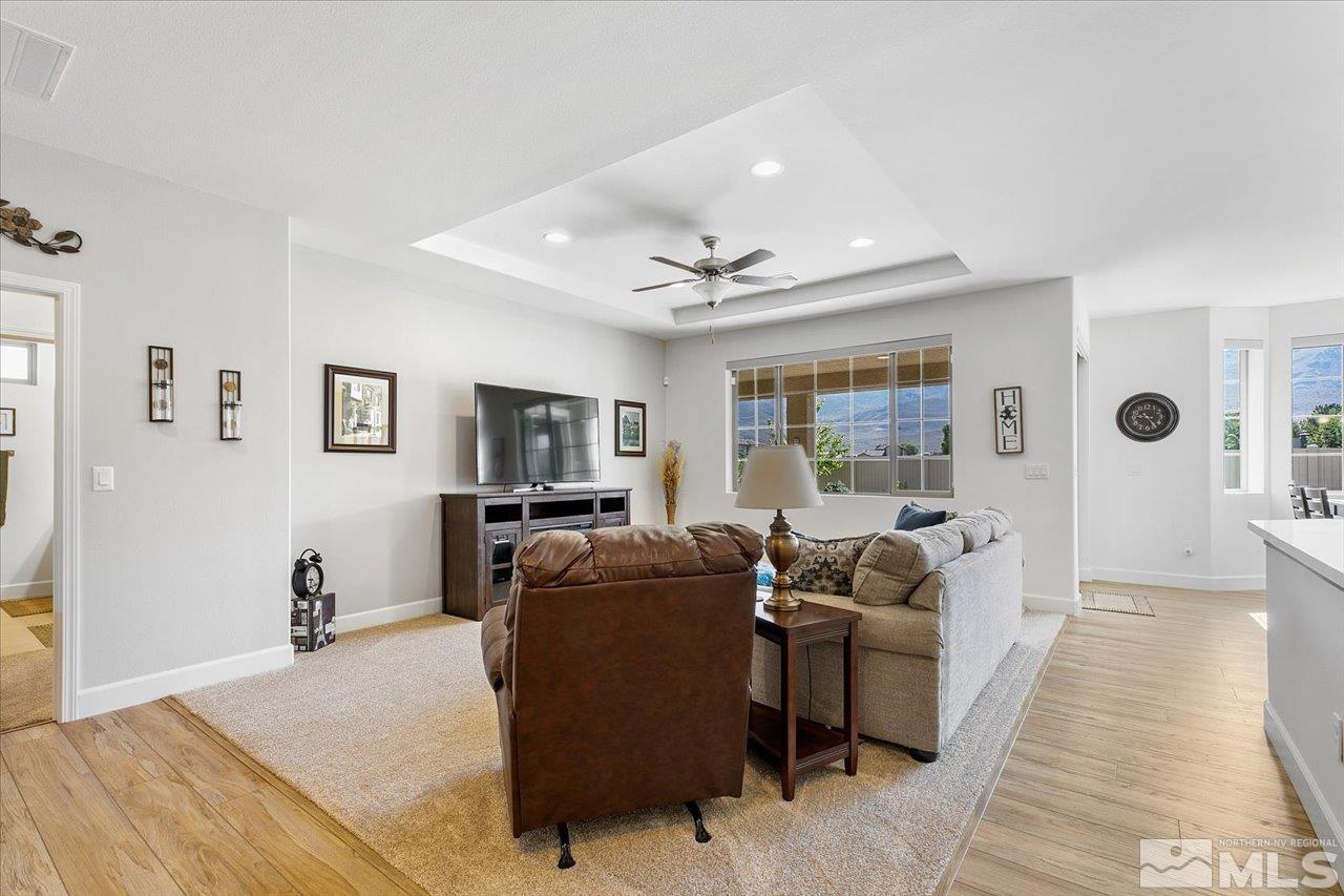 9934 Autumn Sage Drive Reno, NV 89521 - Photo 6 of 39 a living room with furniture and a flat screen tv