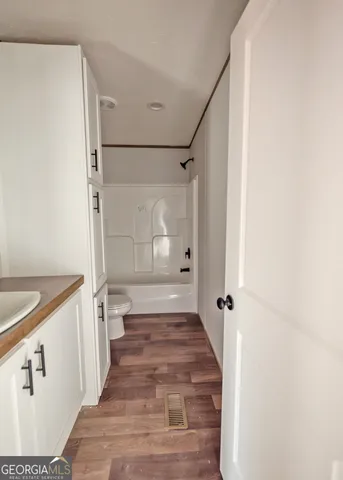 a bathroom with a sink and a shower
