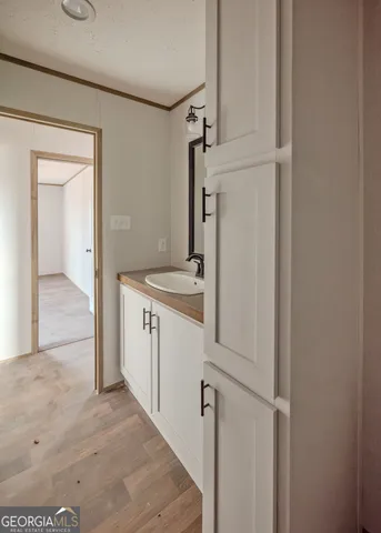 a utility room with cabinets washer and dryer