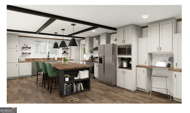 a kitchen with stainless steel appliances kitchen island granite countertop a refrigerator a stove a sink a dining table and chairs