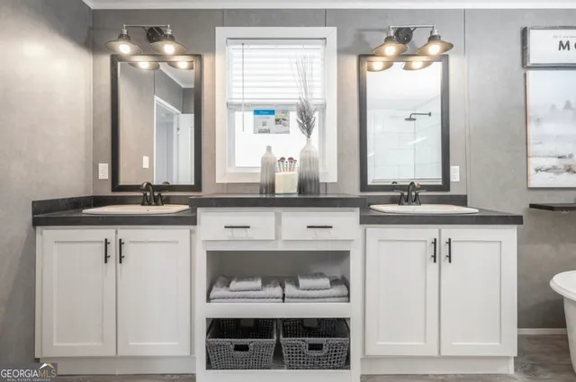 a bathroom with a sink vanity and a mirror