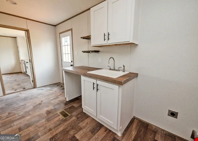 a view of a kitchen with sink and dishwasher
