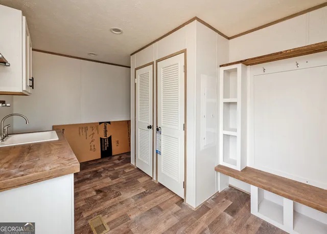 a view of a kitchen cabinets a sink and dishwasher in a kitchen