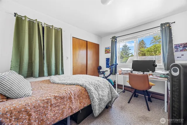 a bedroom with a bed and a chair