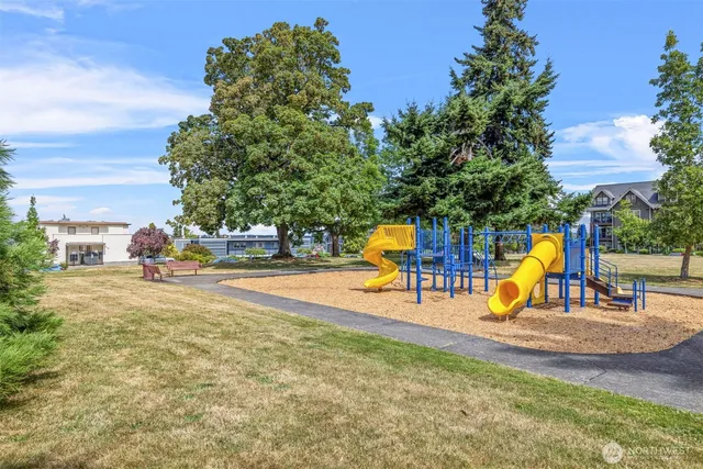 an outdoor space with swimming pool and furniture