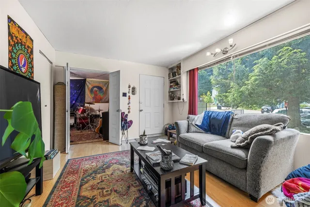 a living room with furniture and a large window