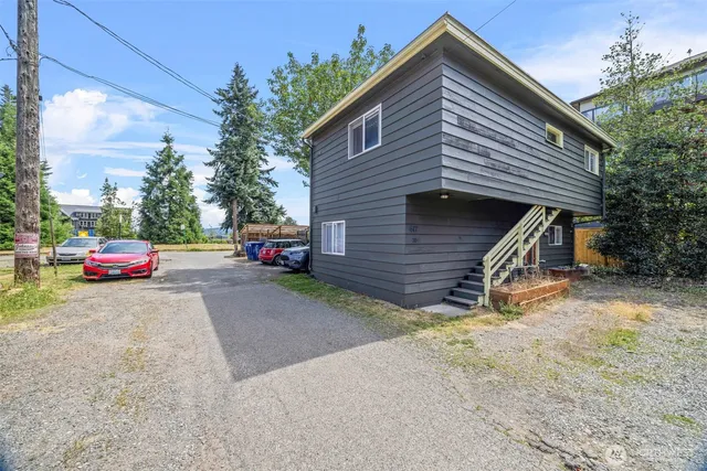 a view of a house with a cars park
