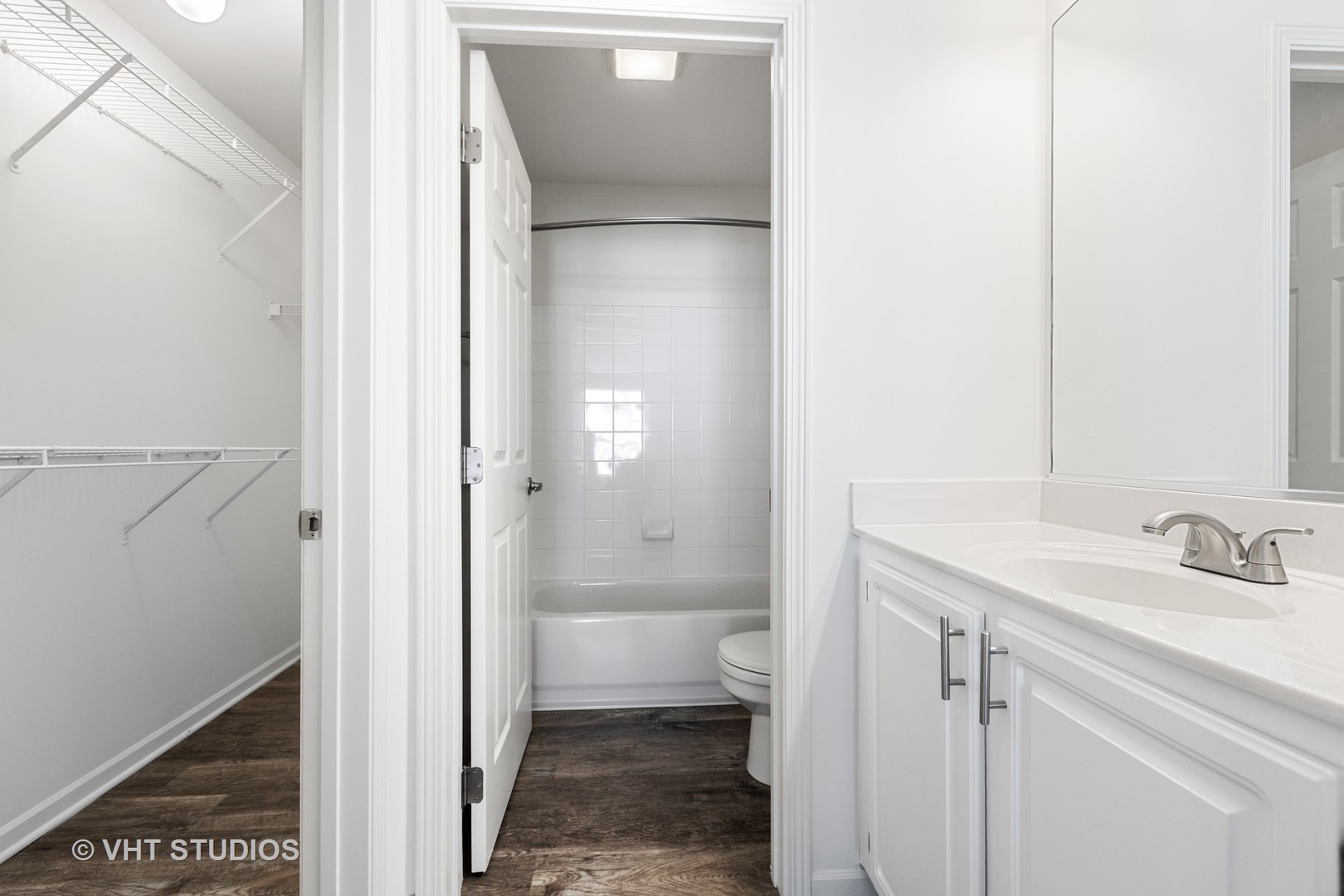 112 Gershwin Court, Unit 112 Wheaton, IL 60189 - Photo 12 of 60 a bathroom with a sink and a toilet