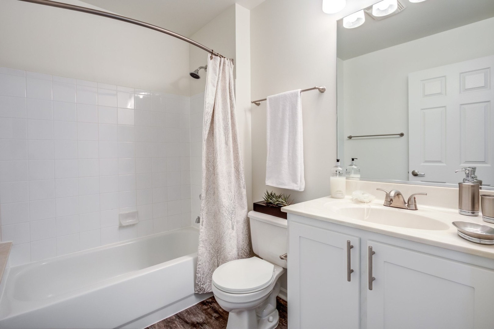 112 Gershwin Court, Unit 112 Wheaton, IL 60189 - Photo 27 of 60 a bathroom with a sink toilet tub and shower