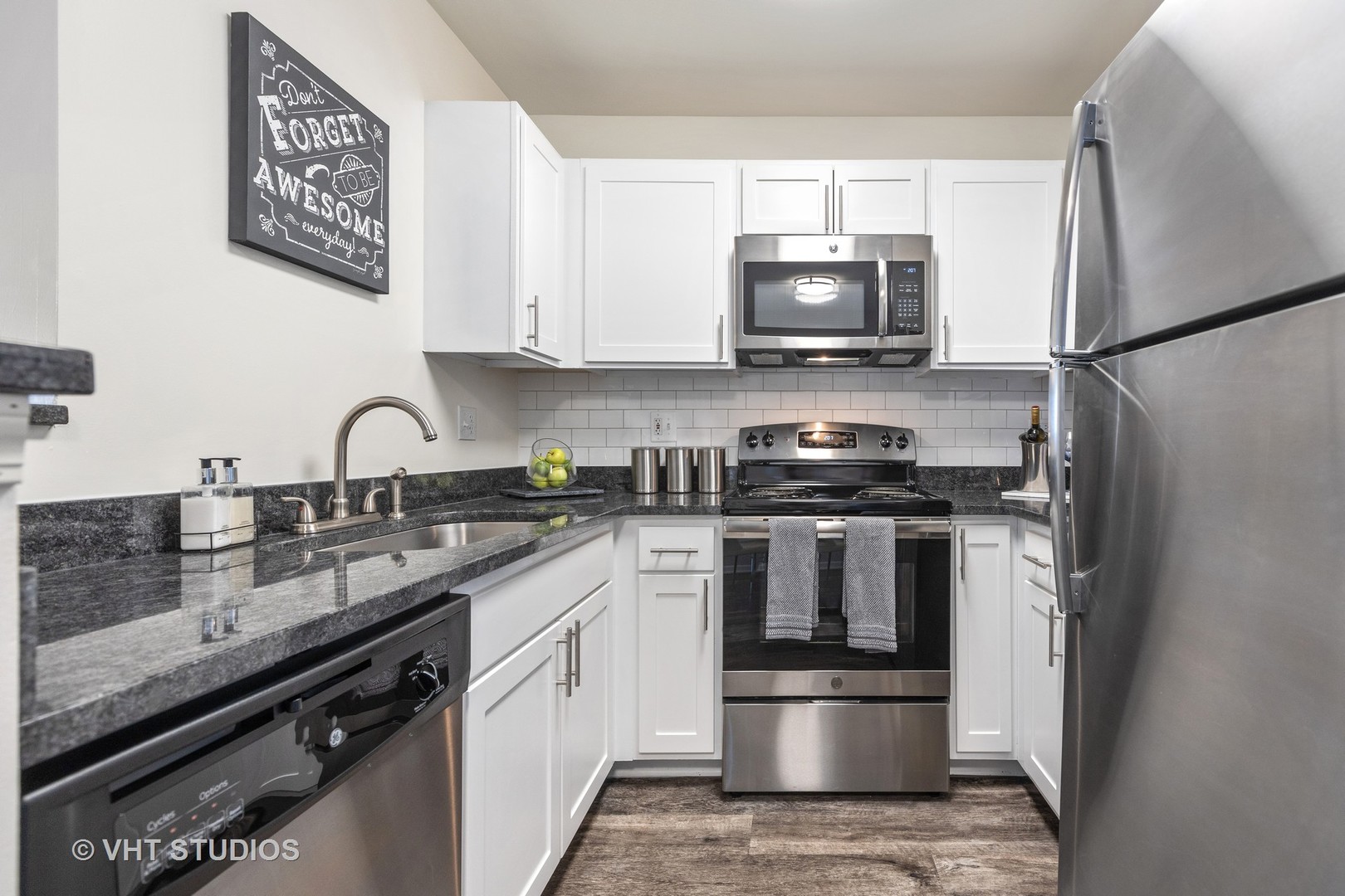 112 Gershwin Court, Unit 112 Wheaton, IL 60189 - Photo 38 of 60 a kitchen with a sink and stainless steel appliances