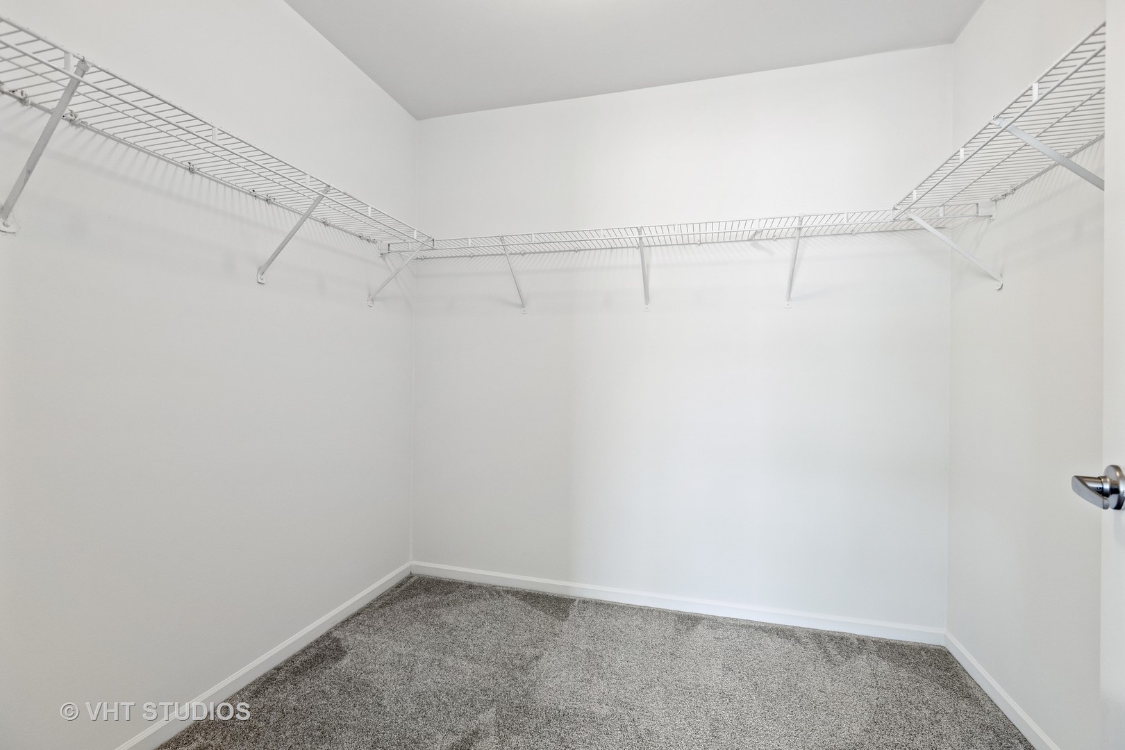 112 Gershwin Court, Unit 112 Wheaton, IL 60189 - Photo 49 of 60 a view of a room with racks on the wall