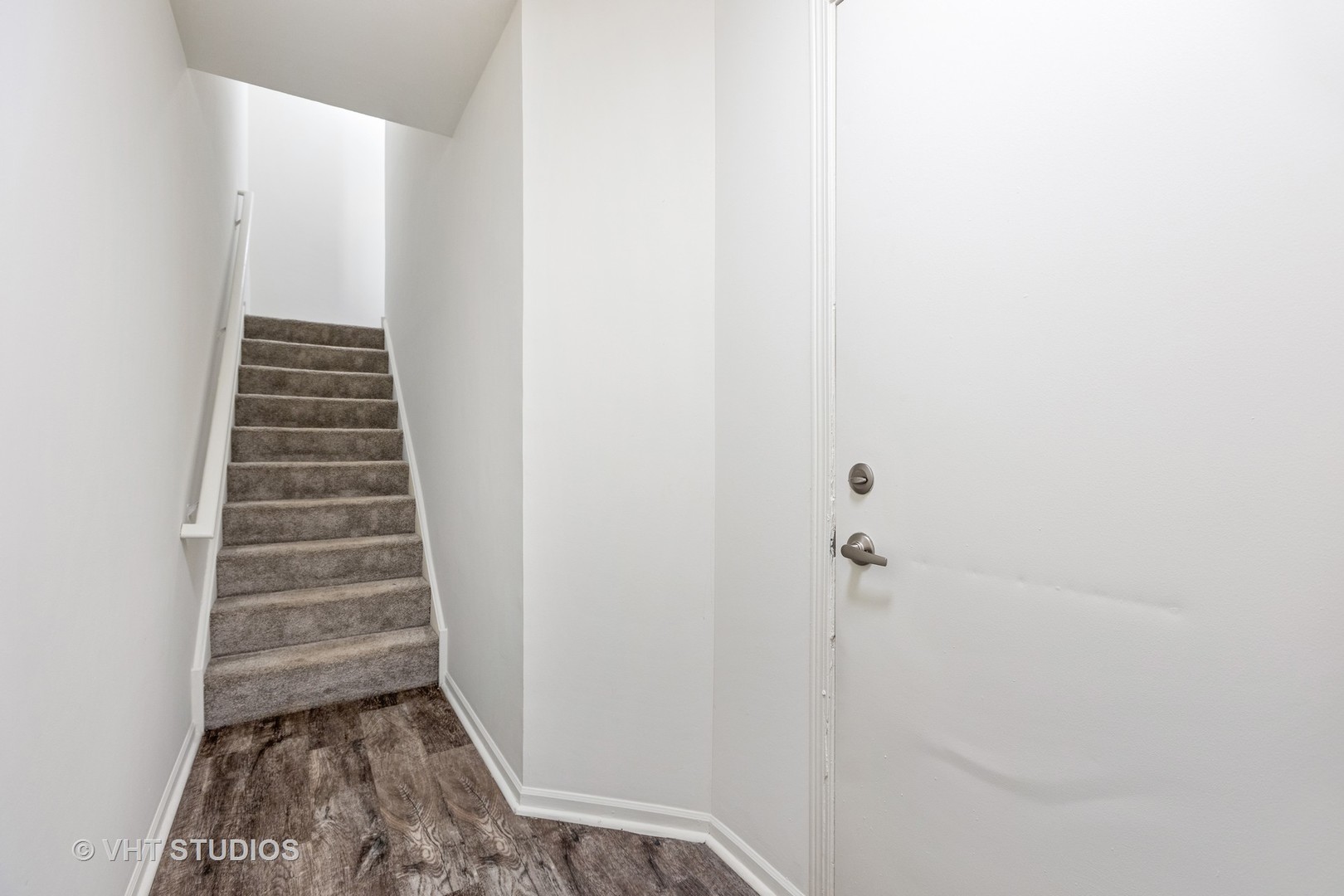 112 Gershwin Court, Unit 112 Wheaton, IL 60189 - Photo 58 of 60 a view of a hallway with stairs and rack
