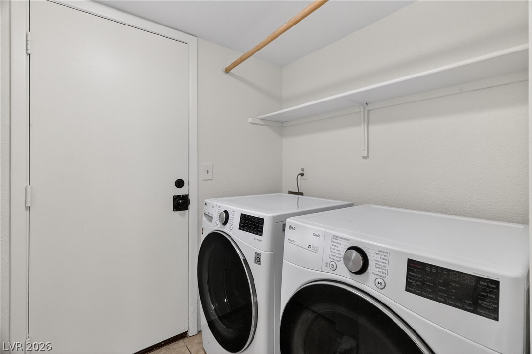 3156 Terrace View Drive Laughlin, NV 89029 - Photo 47 of 94 A well-organized laundry room offers convenience with efficient appliances and built-in shelving.