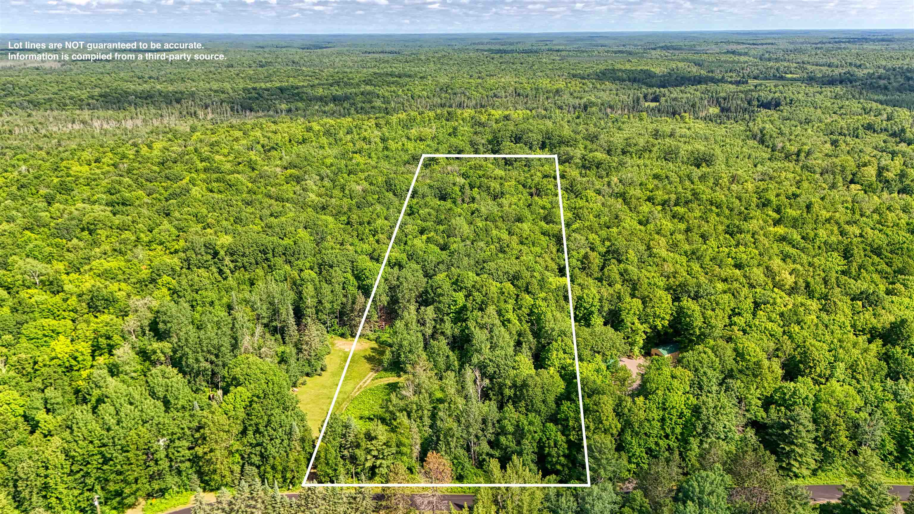 6676 Golf Course Road Winter, WI 54896 - Photo 7 of 51 Aerial view of property's location with a heavily wooded area and property parcel outlined