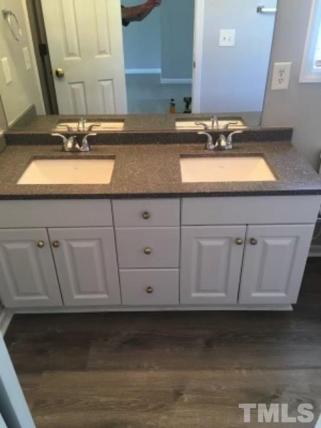 2717 Denbel Circle Raleigh, NC 27604 - Photo 9 of 16 a bathroom with a sink and a mirror