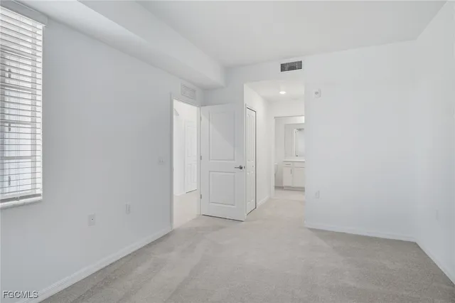 an empty room with a bathroom