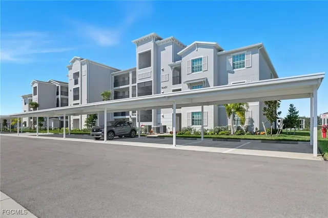 a front view of a building with a garden