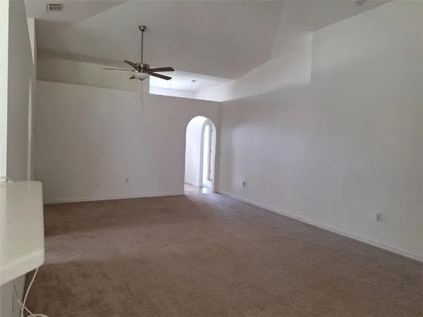 a view of a big room with carpet