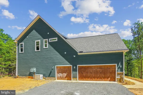 a front view of a house with a garage