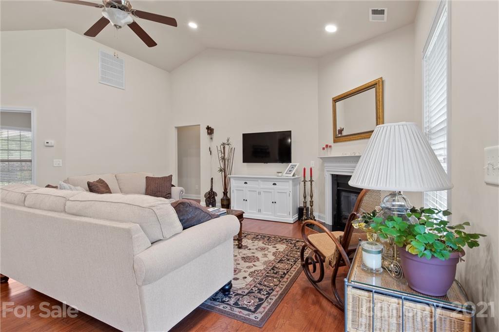 7266 Kenyon Drive Denver, NC 28037 - Photo 4 of 13 a living room with furniture and a flat screen tv