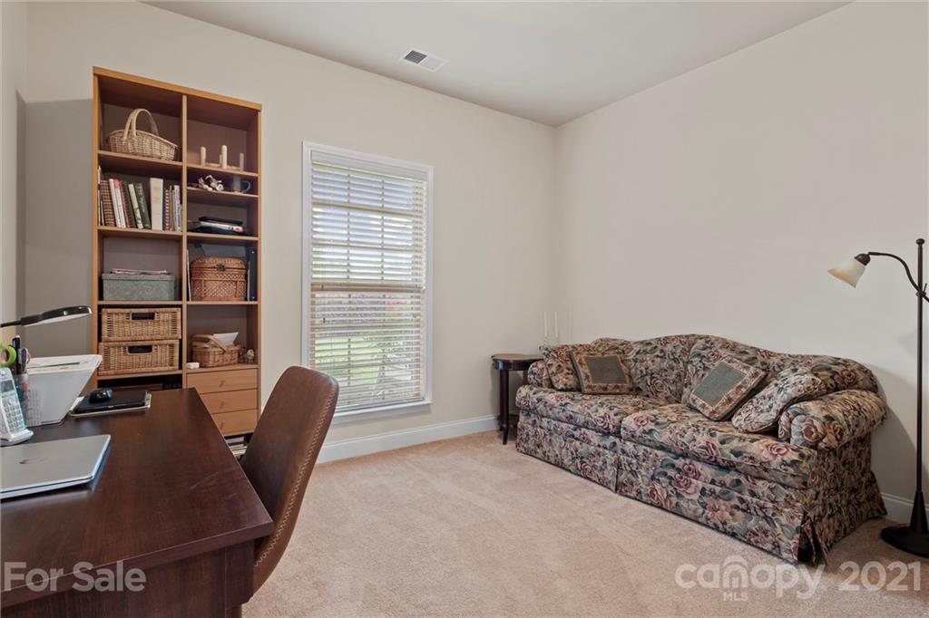 7266 Kenyon Drive Denver, NC 28037 - Photo 8 of 13 a living room with furniture and a window