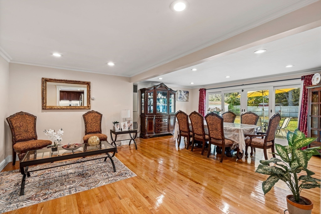 13 Sunnyvale Street Beverly, MA 01915 - Photo 11 of 18 a living room with lots of furniture a rug and flat screen tv
