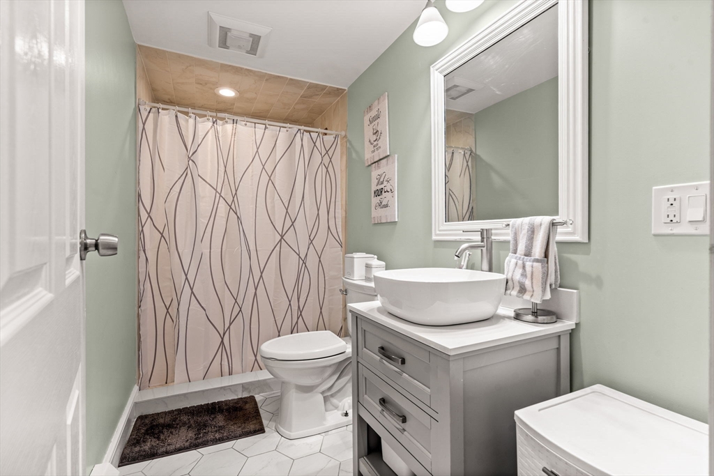 13 Sunnyvale Street Beverly, MA 01915 - Photo 13 of 18 a bathroom with a sink toilet and shower