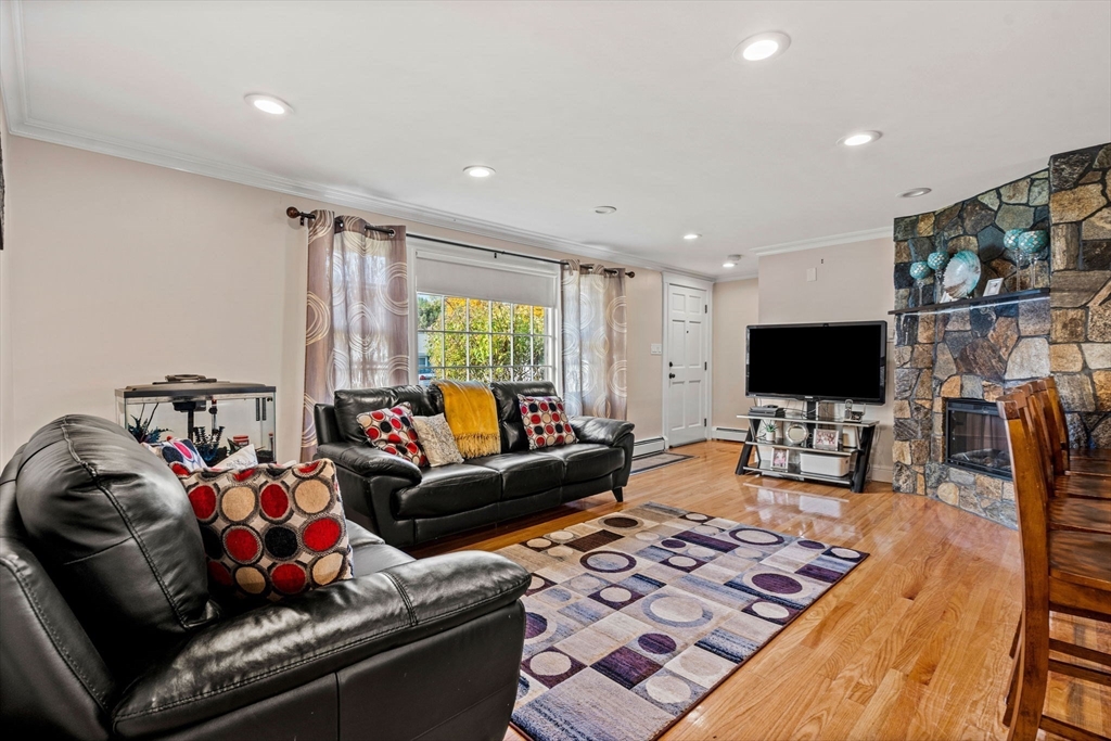 13 Sunnyvale Street Beverly, MA 01915 - Photo 5 of 18 a living room with furniture and a flat screen tv