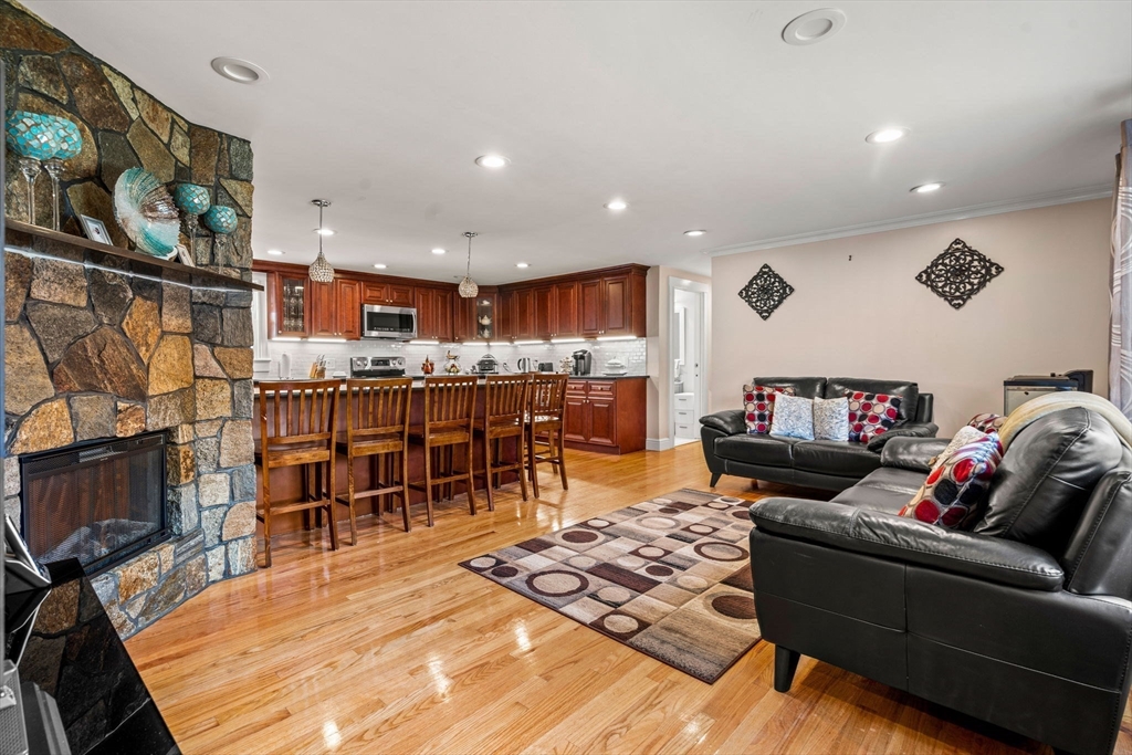 13 Sunnyvale Street Beverly, MA 01915 - Photo 6 of 18 a living room with furniture and a wooden floor