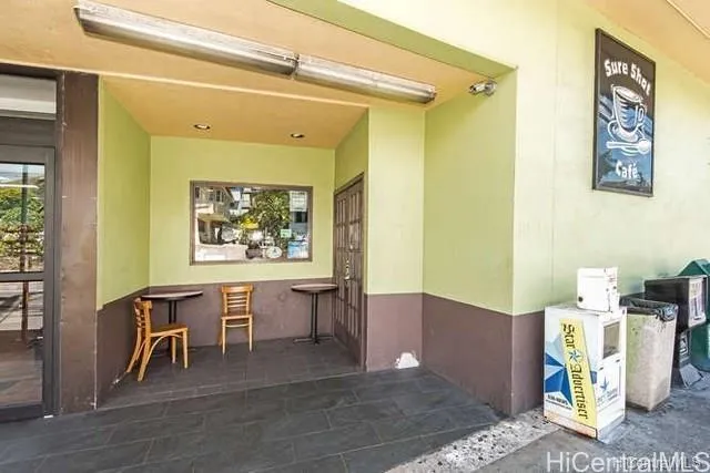 a view of workspace with furniture and window