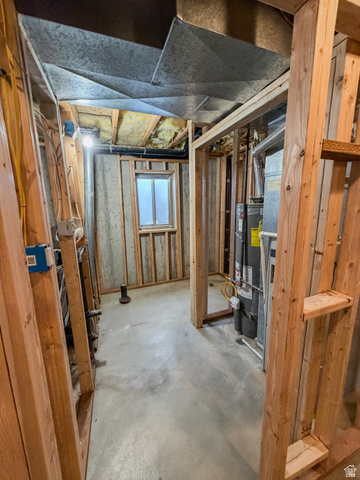 680 Timpie Road Tooele, UT 84074 - Photo 20 of 31 Unfinished basement space featuring exposed wooden framing, concrete flooring, galvanized ductwork, and a small window